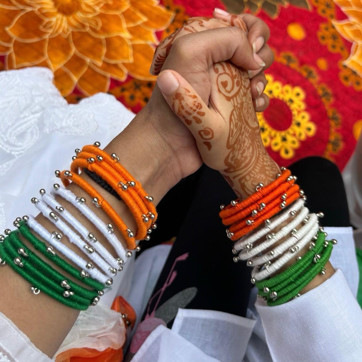 Handcrafted Tiranga Thread Bangles with Silver Ghungroo Beads (Set of 12) thumbnail 2